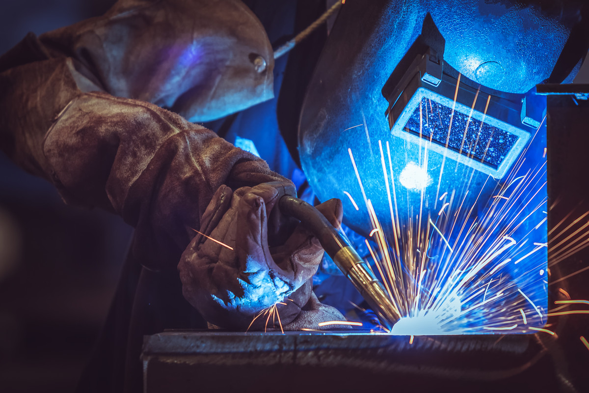 Metal fabricator welding in the Sweetwater Metal Products shop